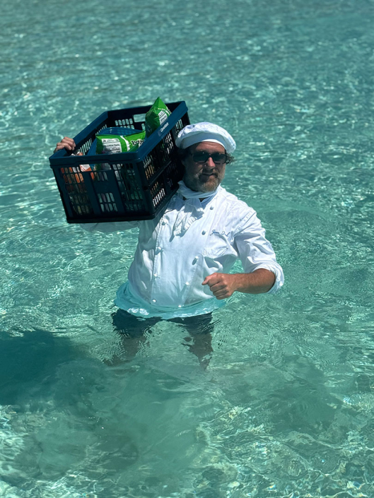 Chef Jim Ruch hauling provisions - Operation Beach Barbecue. Yachting Bahamas.